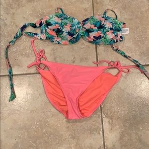 Floral swimsuit top and coral swim bottoms